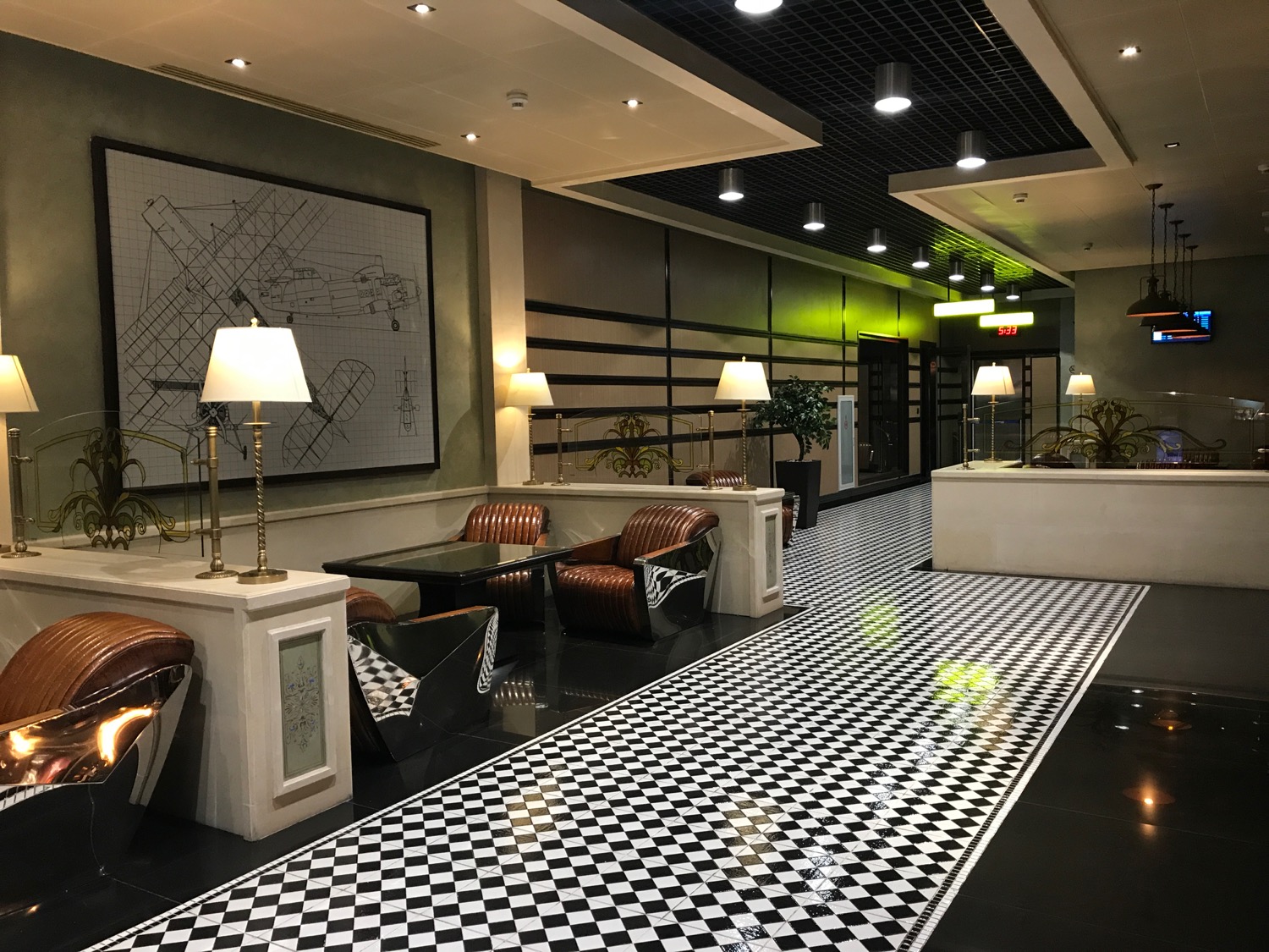 a black and white checkered floor in a hotel lobby