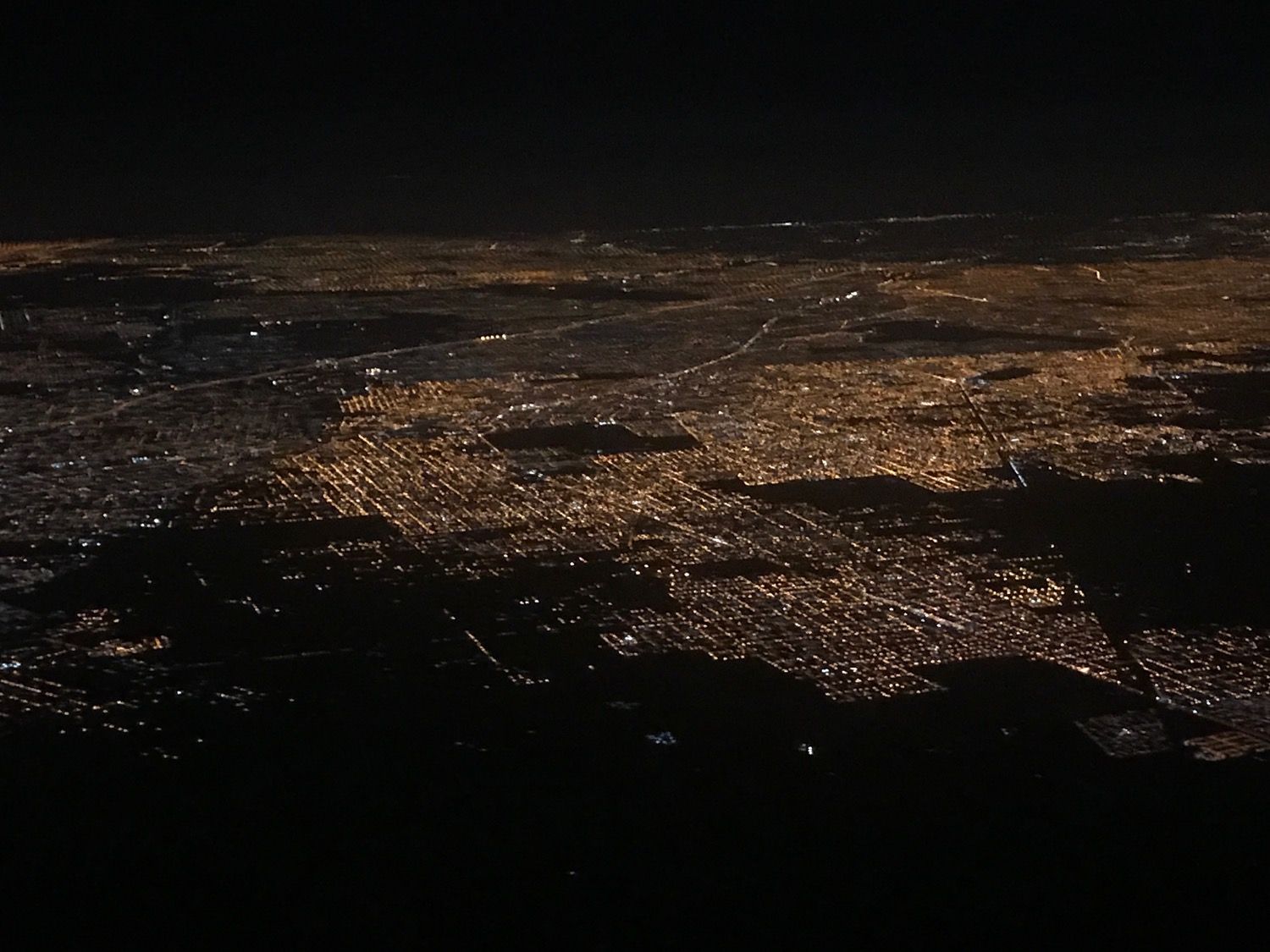 an aerial view of a city at night
