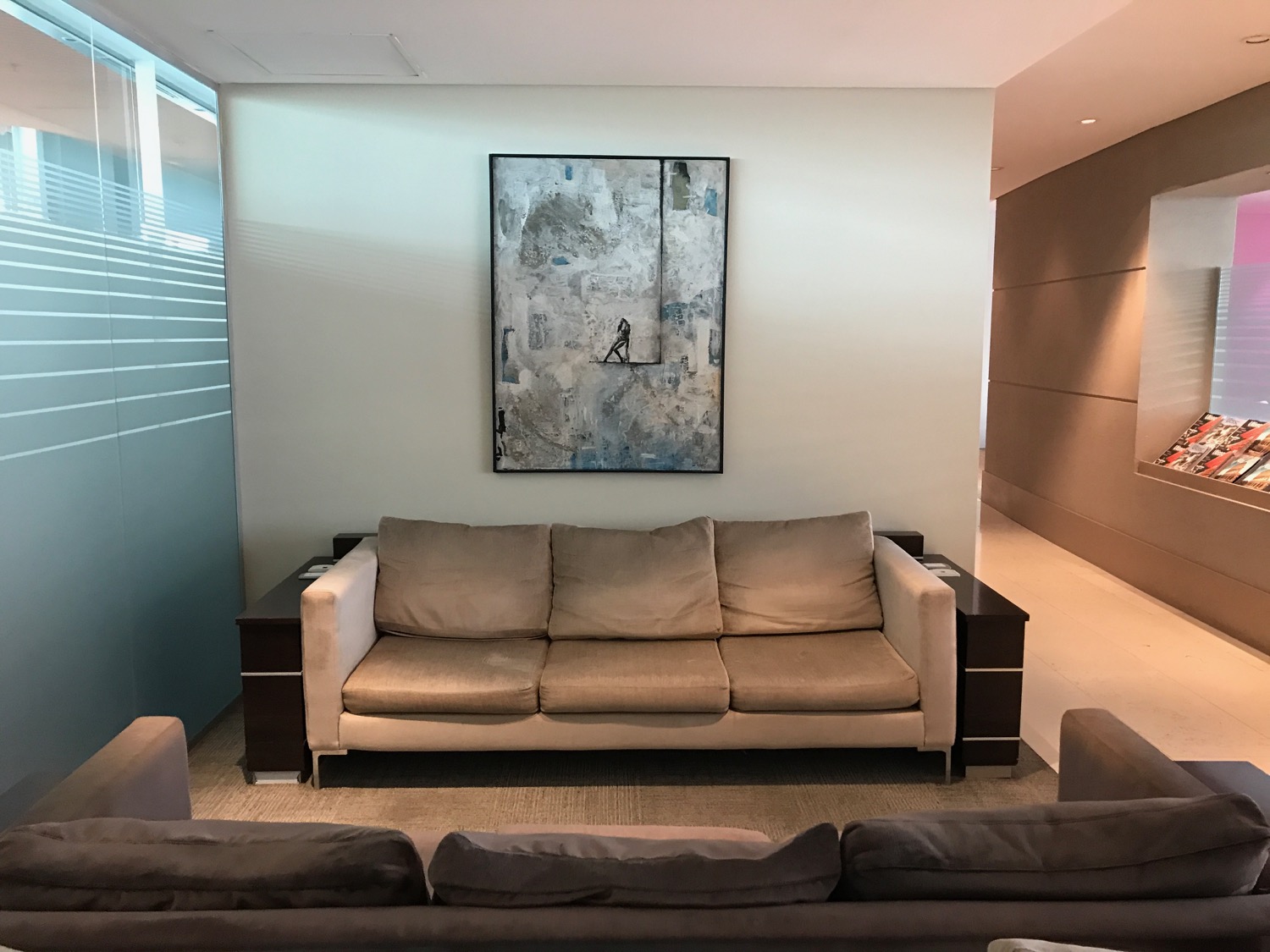 a couches and a painting on the wall