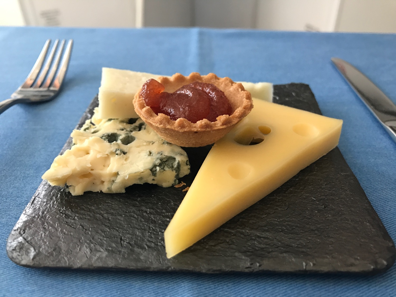 a plate of cheese and jam