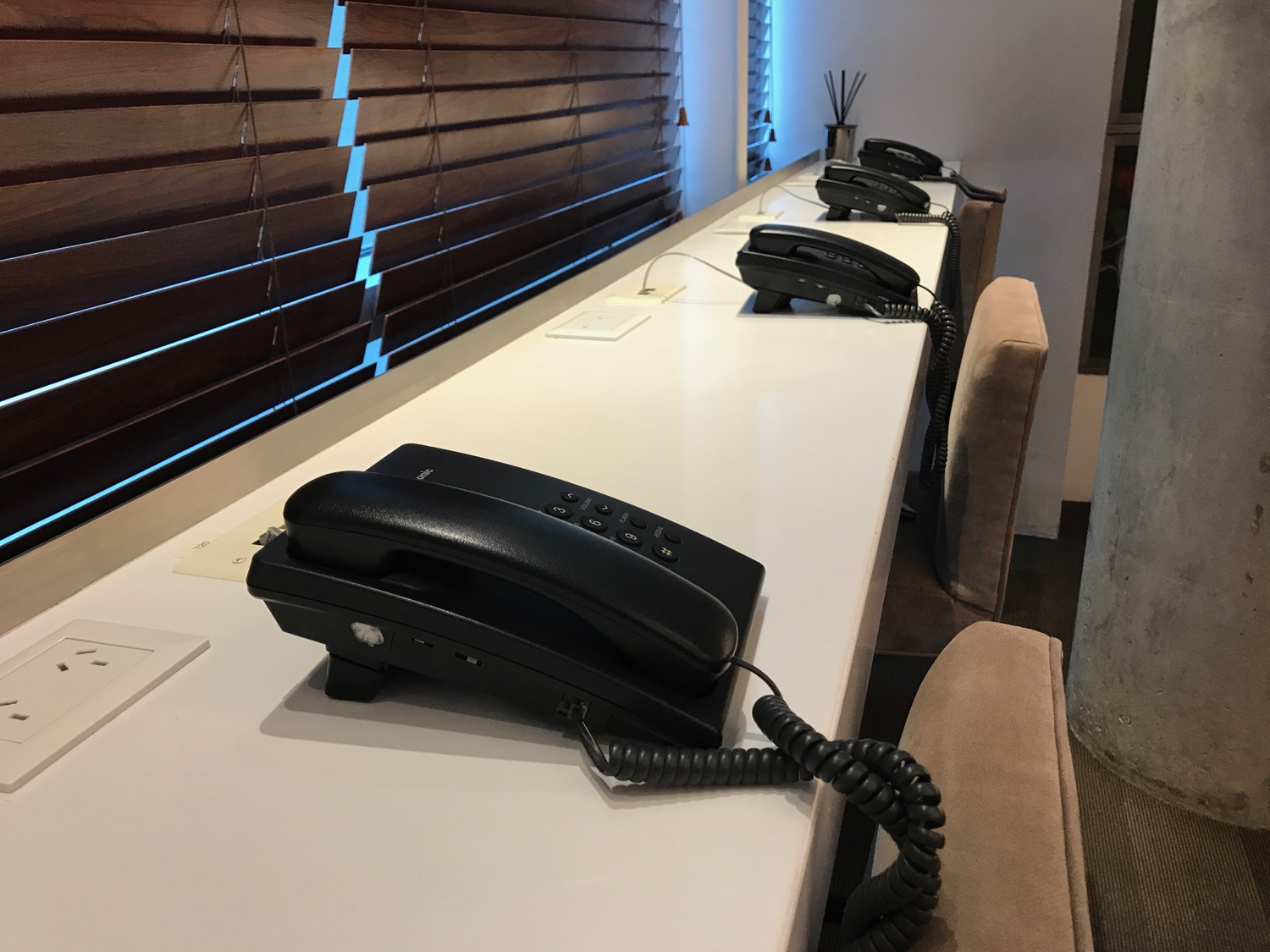 a row of telephones on a counter