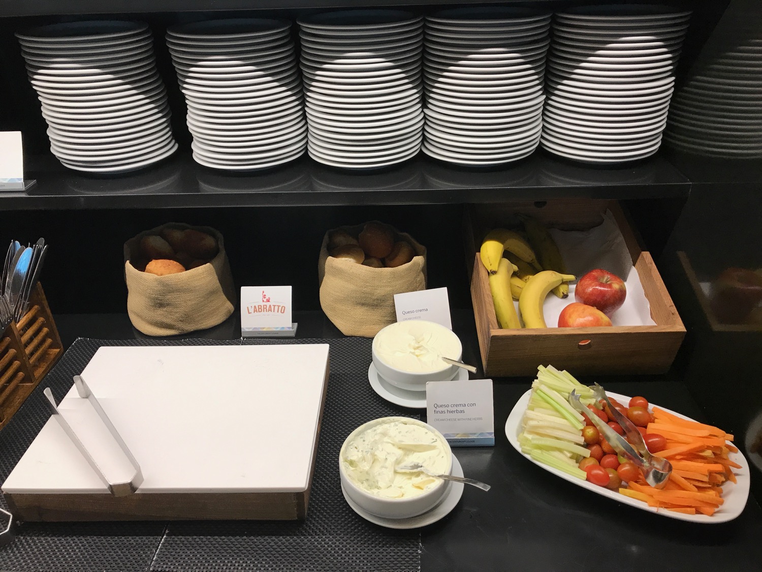a shelf with plates and food on it