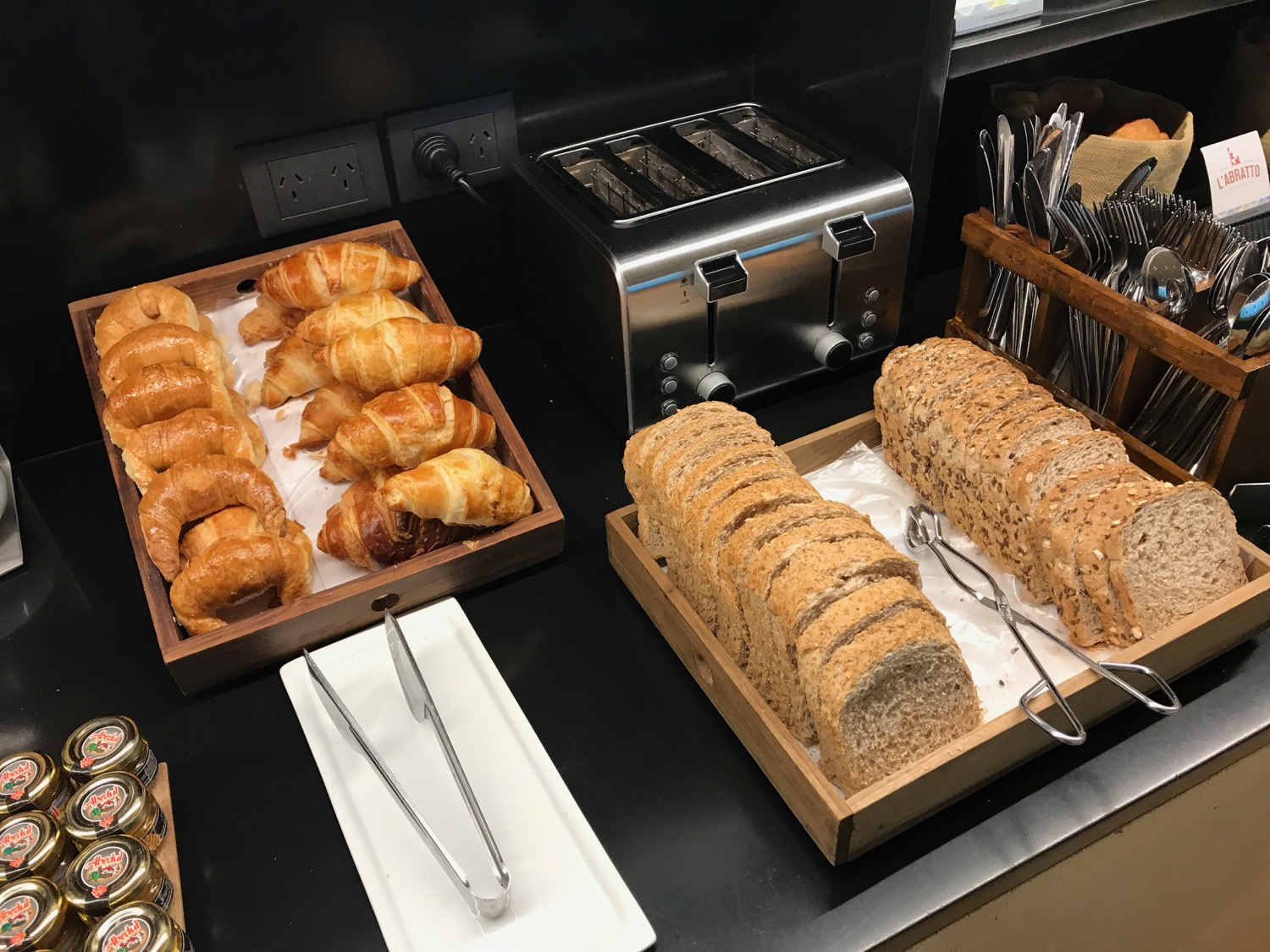 a table with bread and croissants