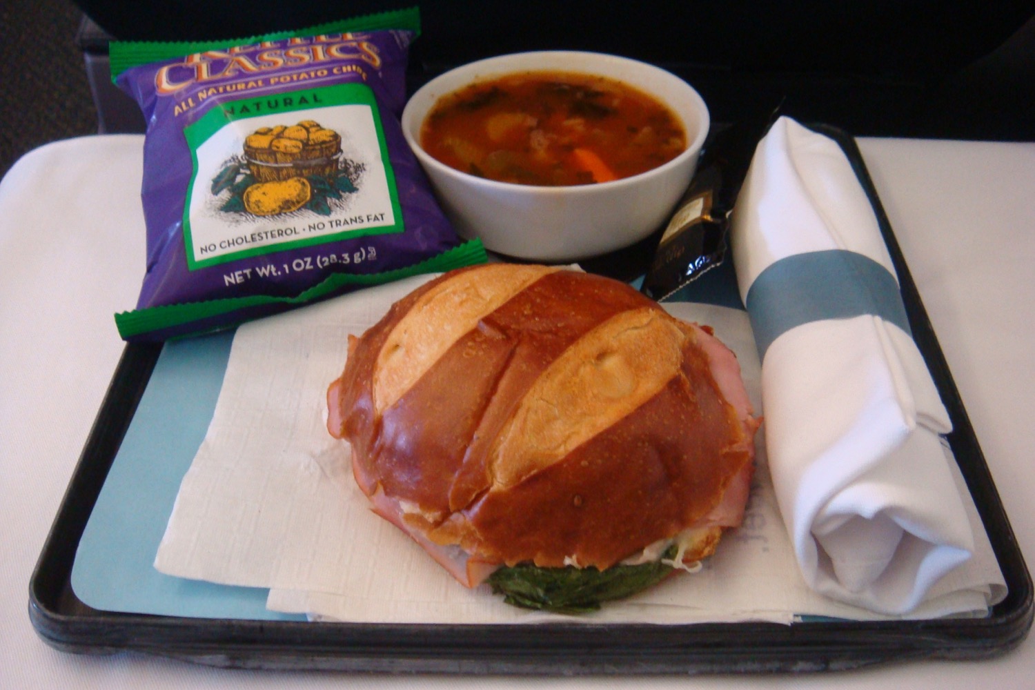 a sandwich and soup on a tray