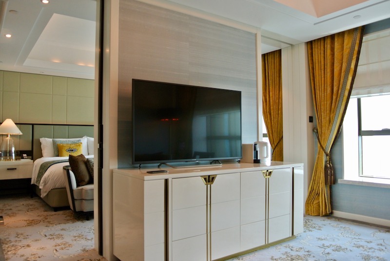 Minibar under the TV, coffee machine to the right