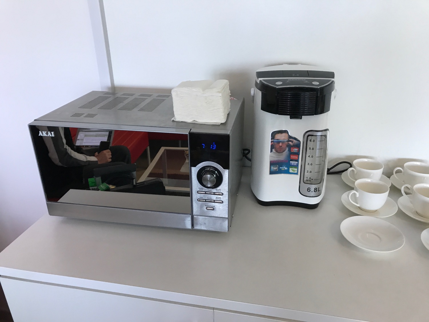 a microwave and coffee maker on a counter