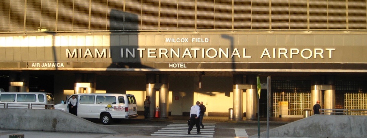 a man walking in front of a hotel