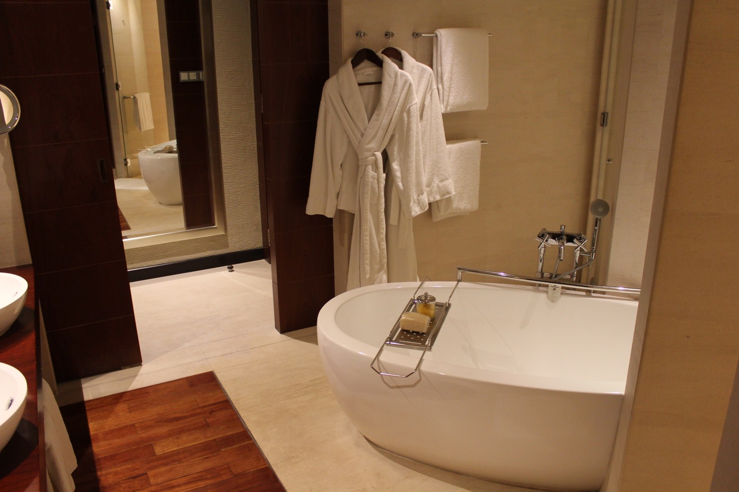 a bathrobe and bathtub in a bathroom