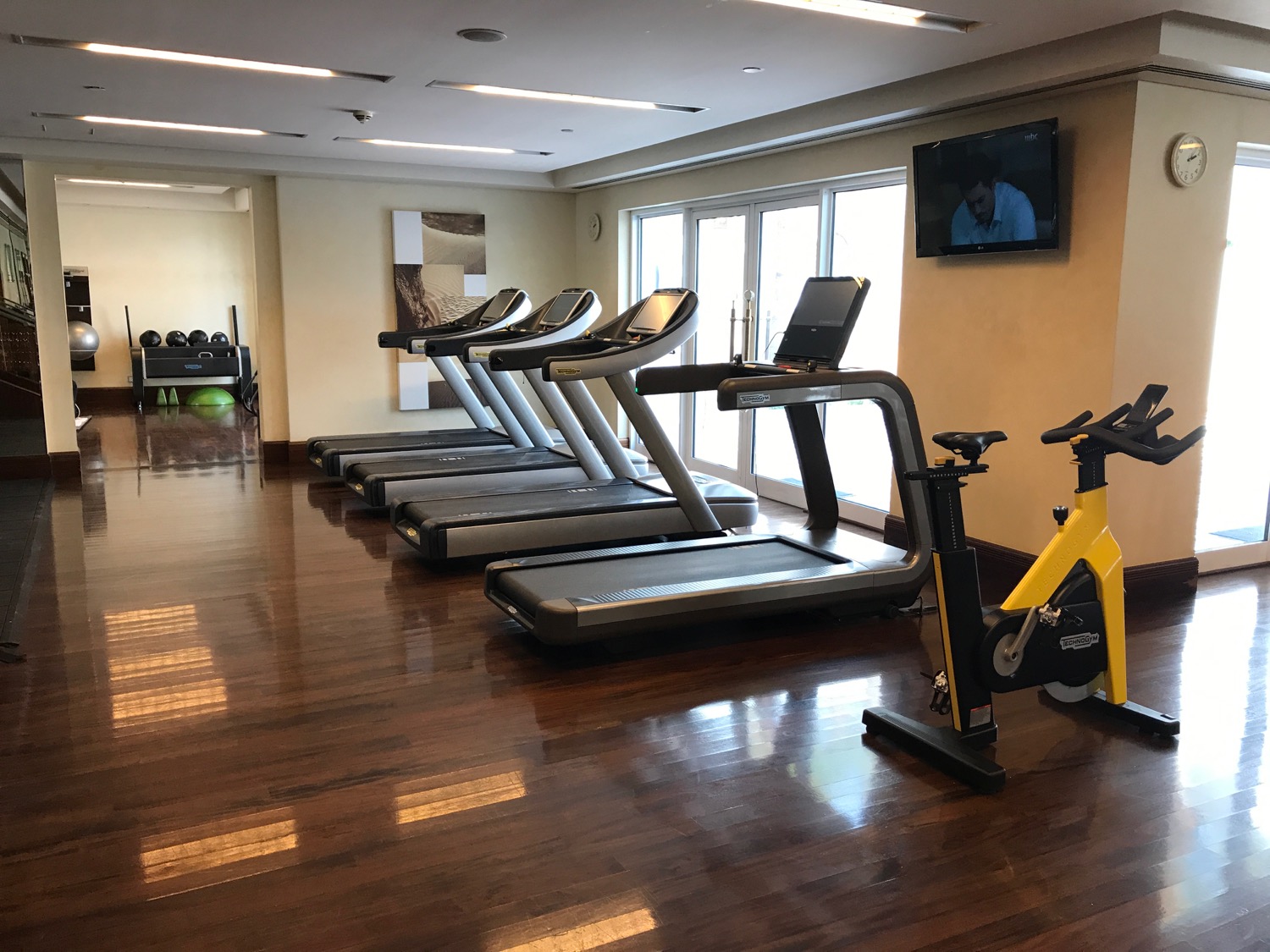 a room with treadmills and exercise bikes