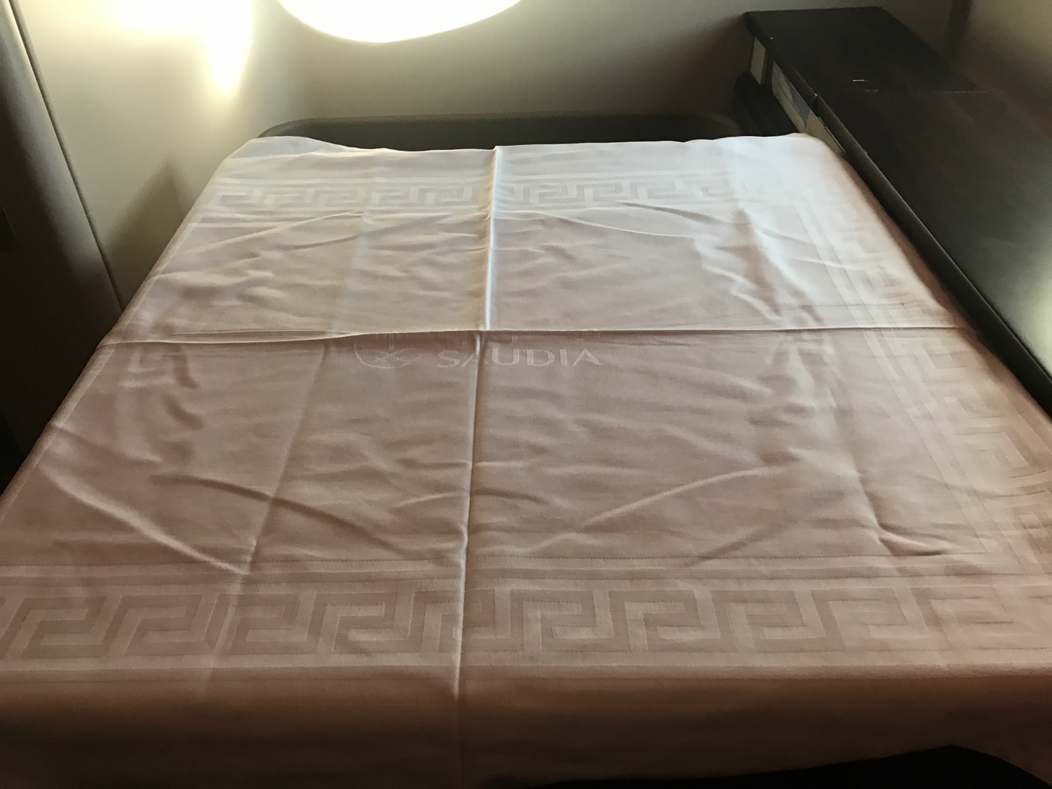 a bed with a white sheet on it