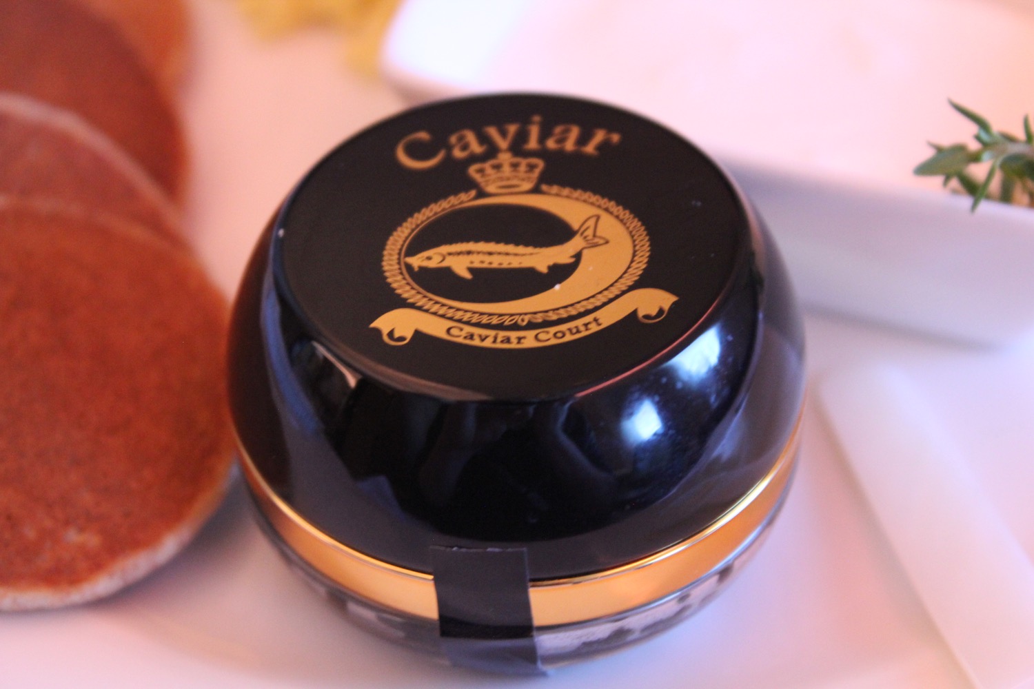 a black container with gold text on it
