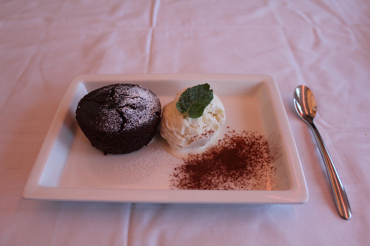 a plate of dessert with a spoon