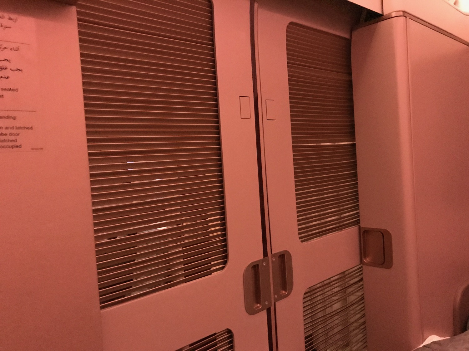pink door with metal panel