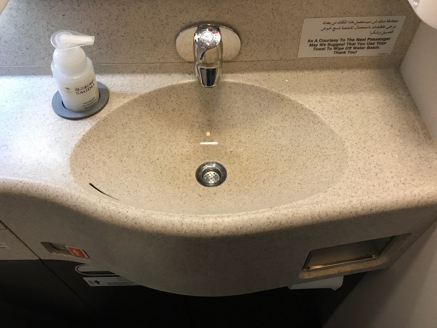 a sink with a faucet and soap on it