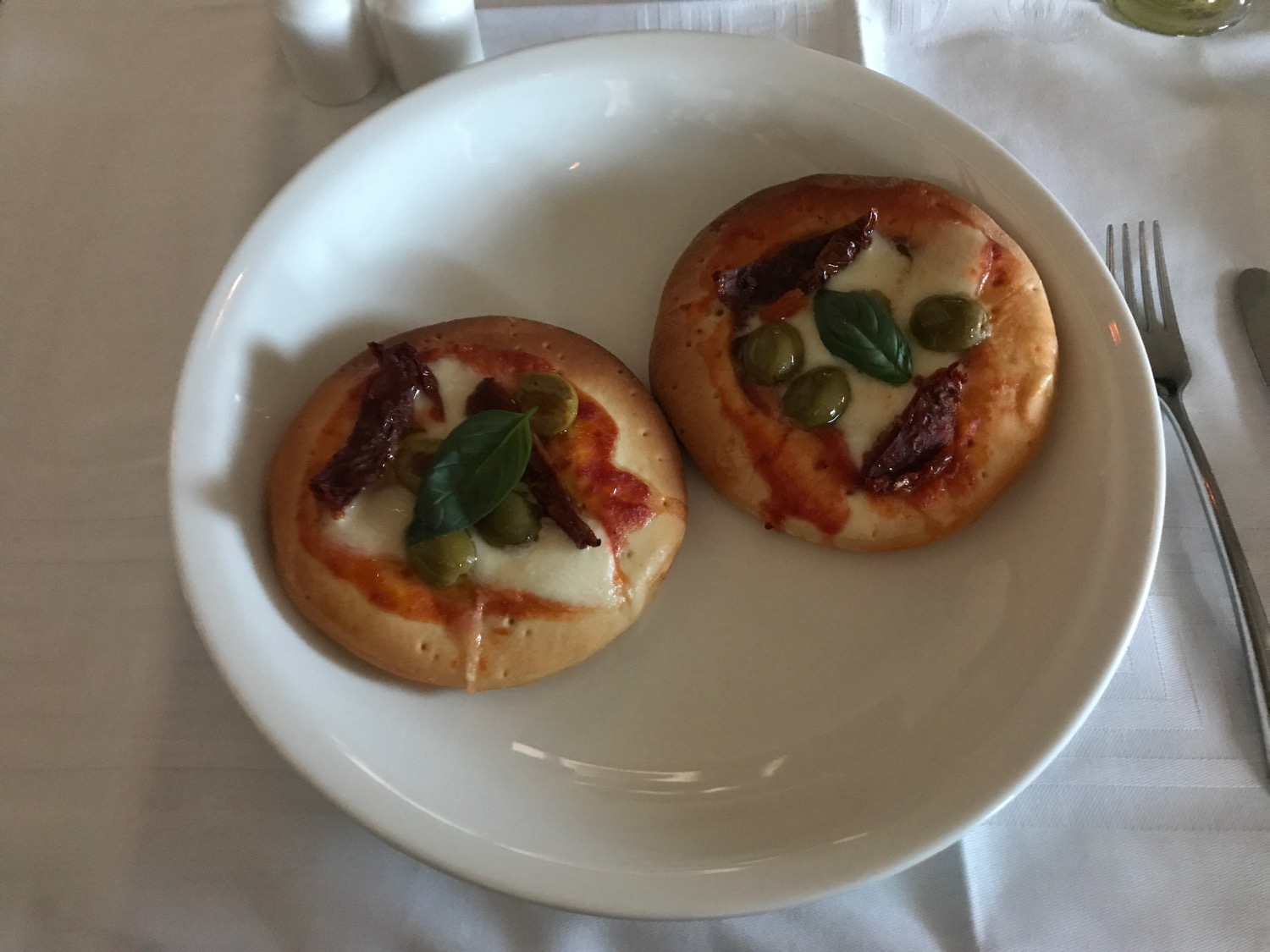 two small pizzas on a plate