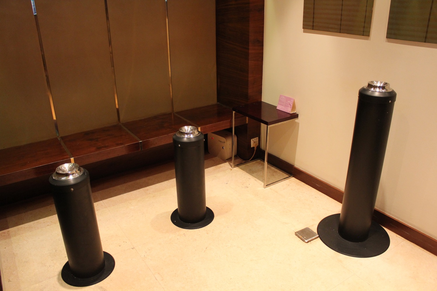 a group of black pillars in a room