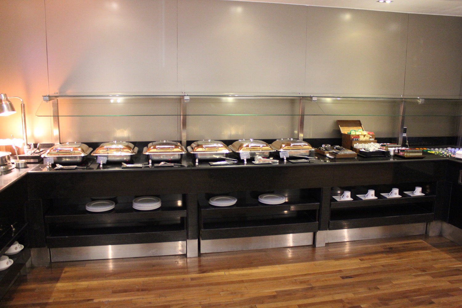 a buffet line with trays of food
