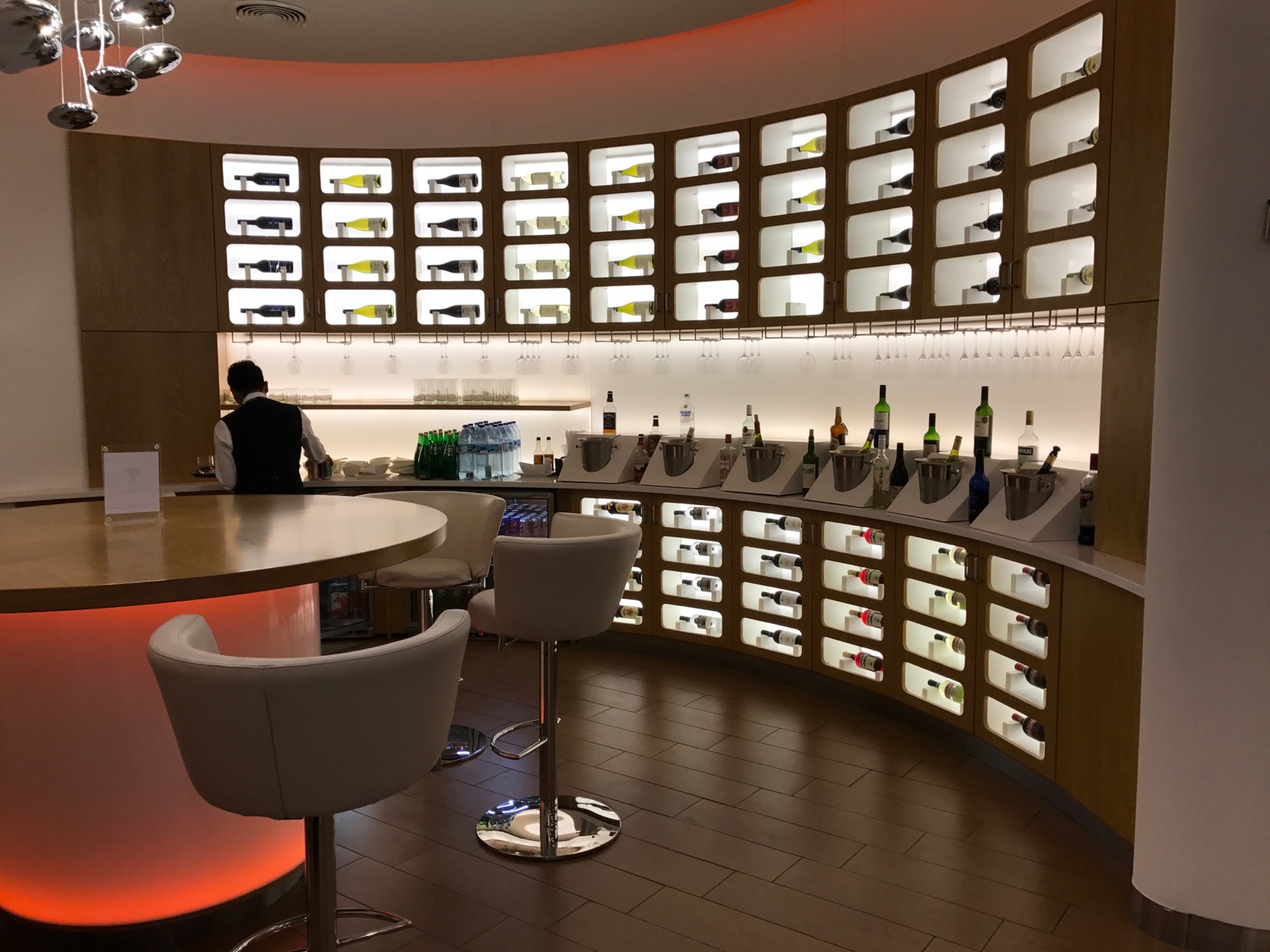 a bar with shelves of bottles and bottles