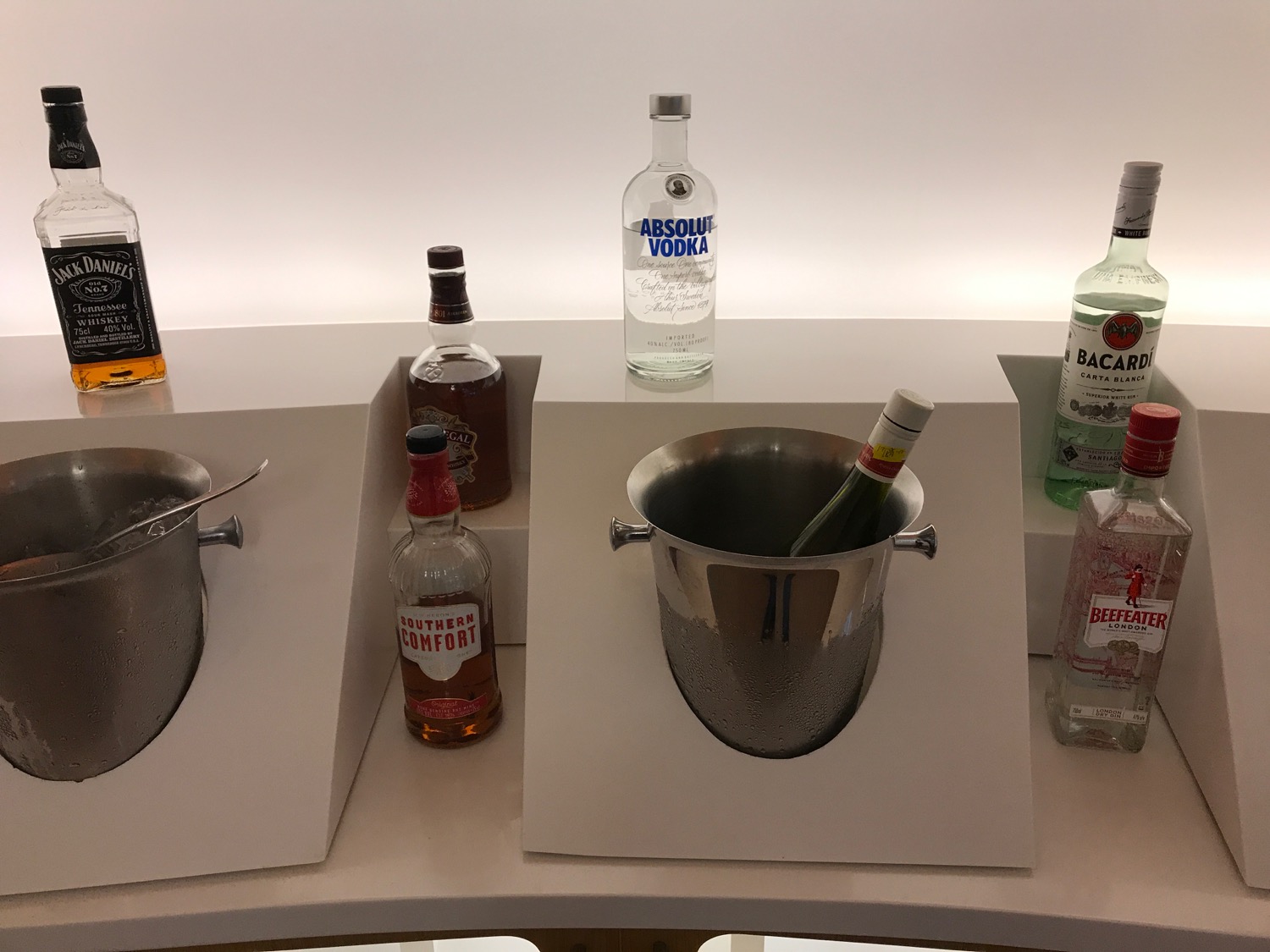 a group of bottles of alcohol in a bucket