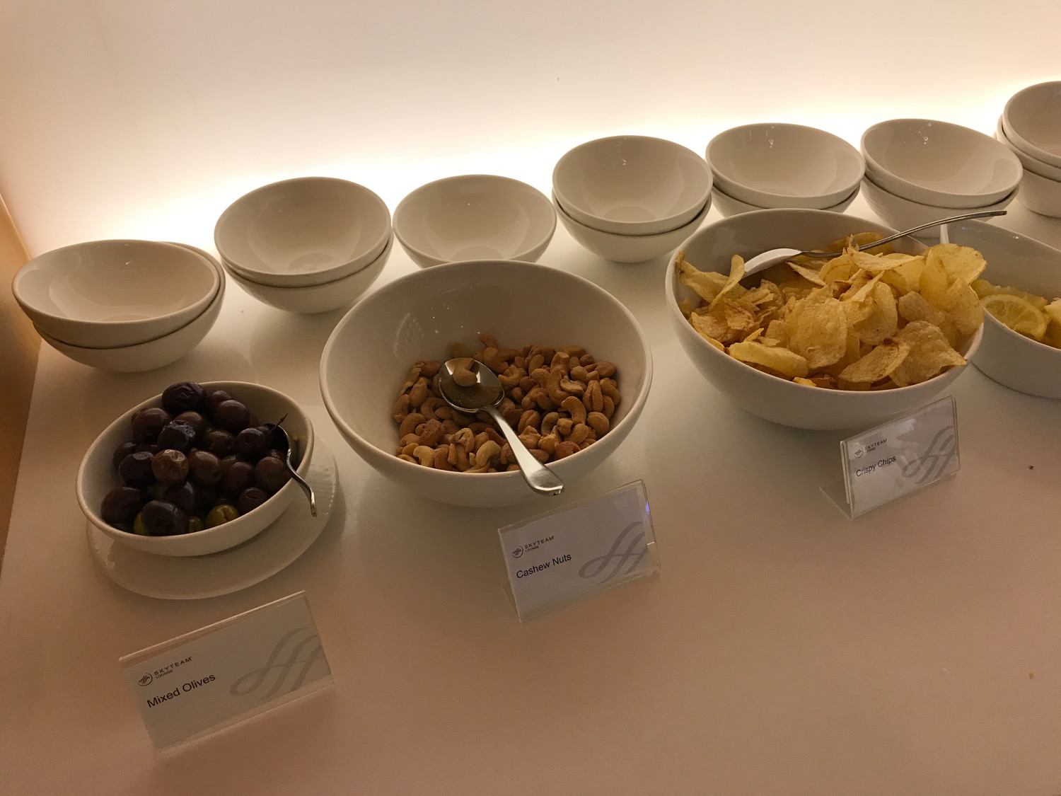 a row of bowls with different types of food