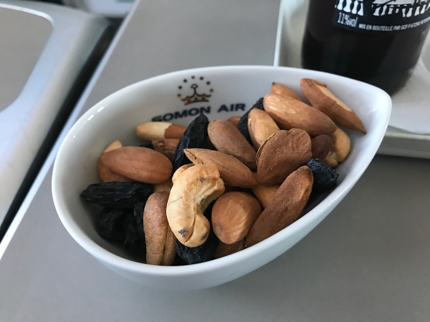 a bowl of nuts and raisins