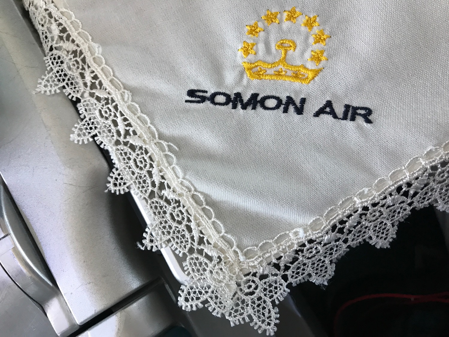 a white handkerchief with lace trim