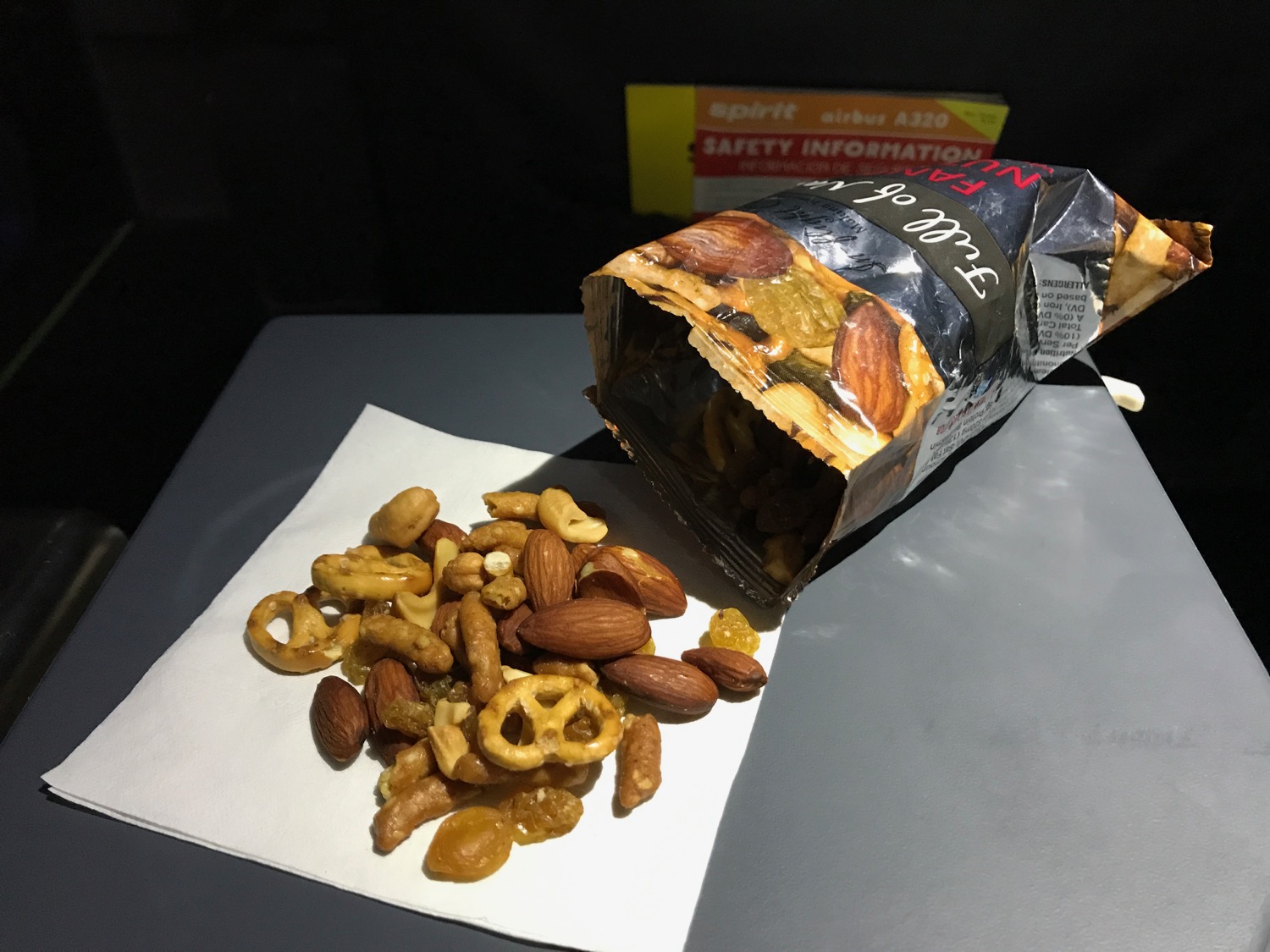 a bag of nuts and pretzels on a table