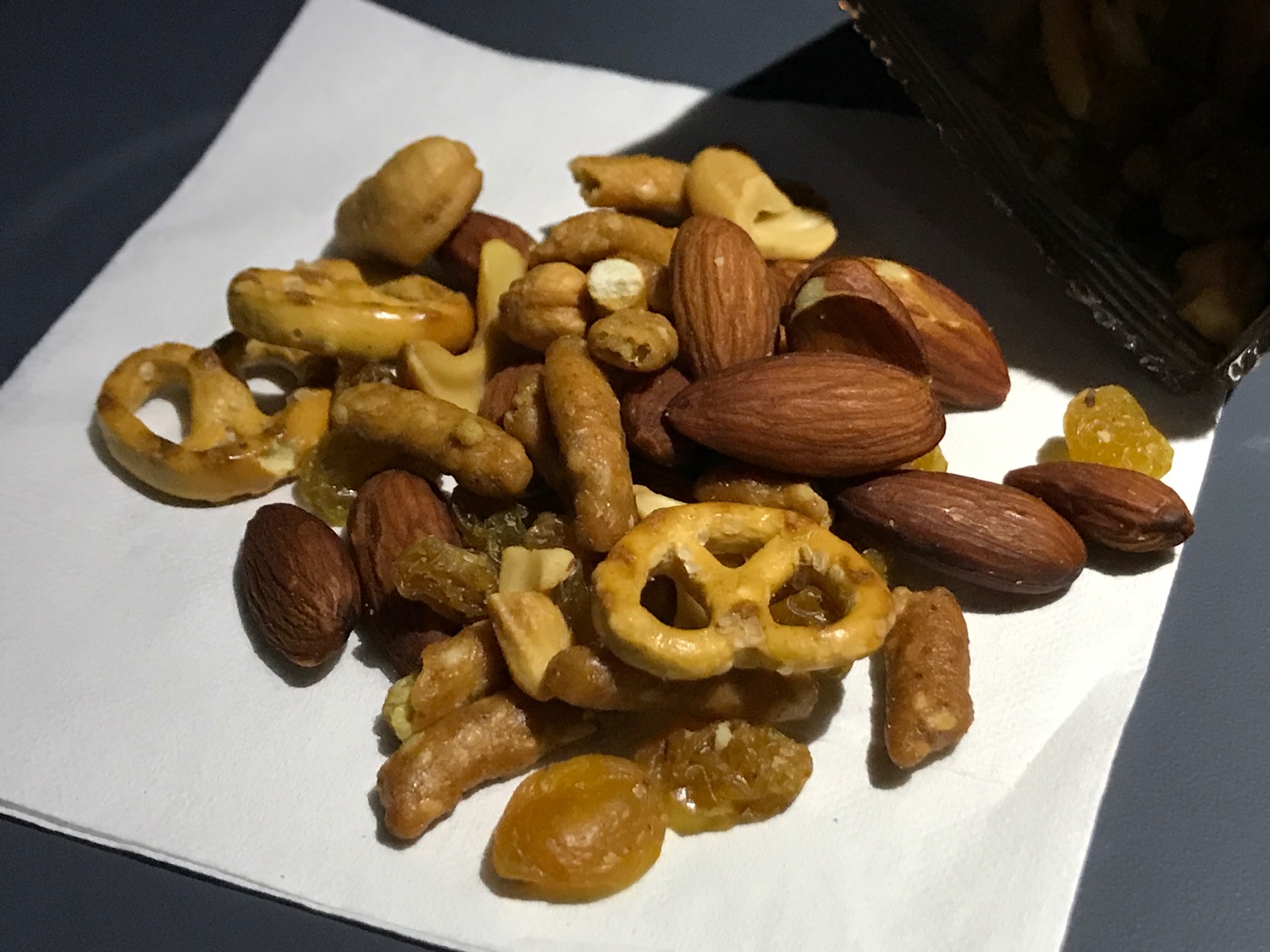 a pile of nuts and raisins on a napkin
