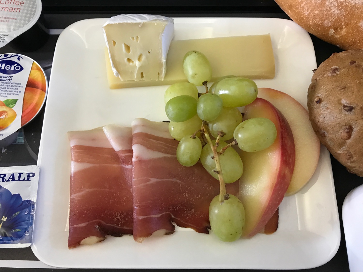 a plate of food with fruit and cheese