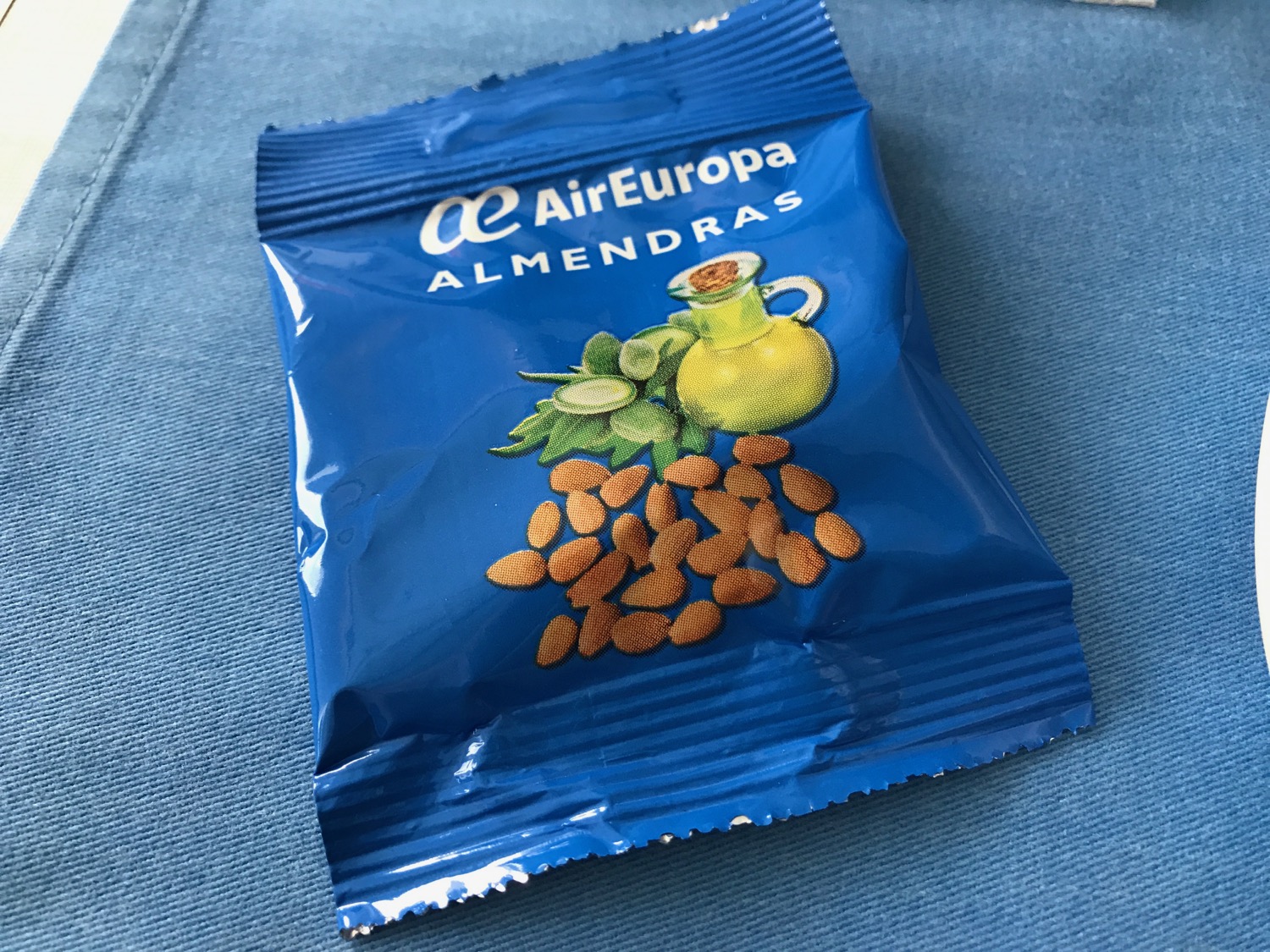 a blue packet with a picture of nuts on it