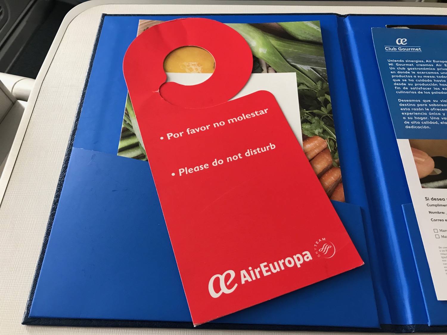 a red tag on a blue folder