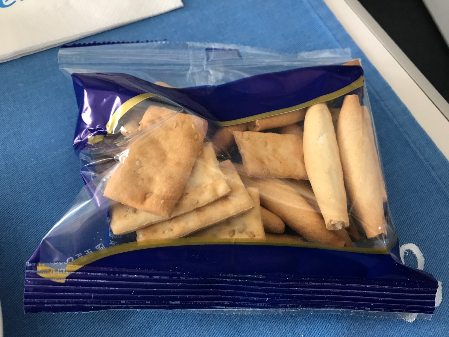 a bag of crackers on a blue surface