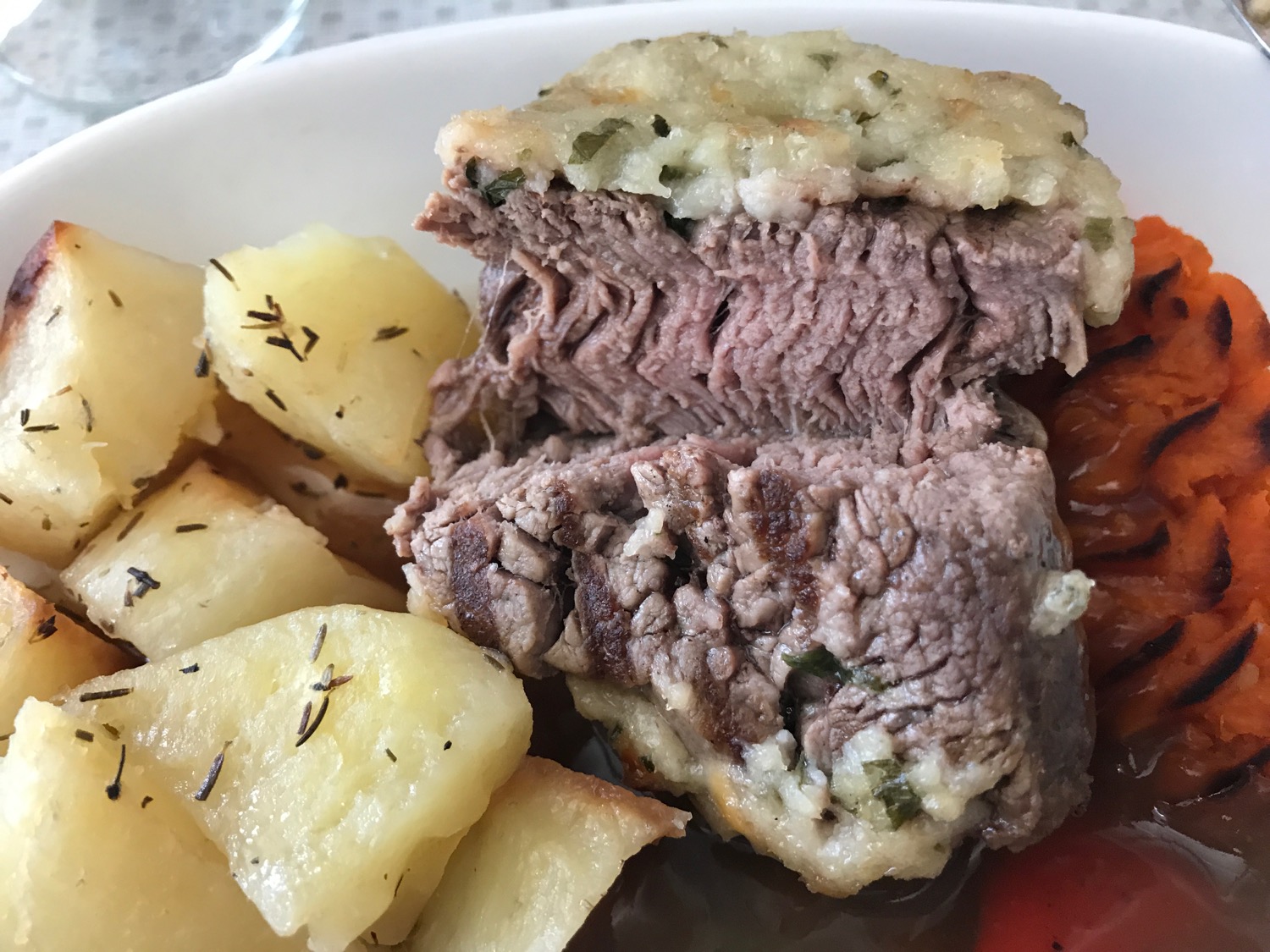 a plate of food with meat and potatoes