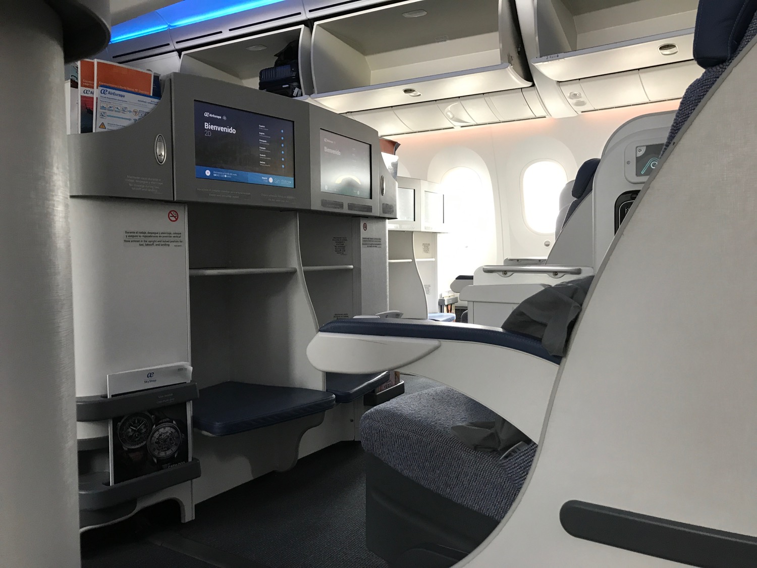 an airplane with a seat and a monitor