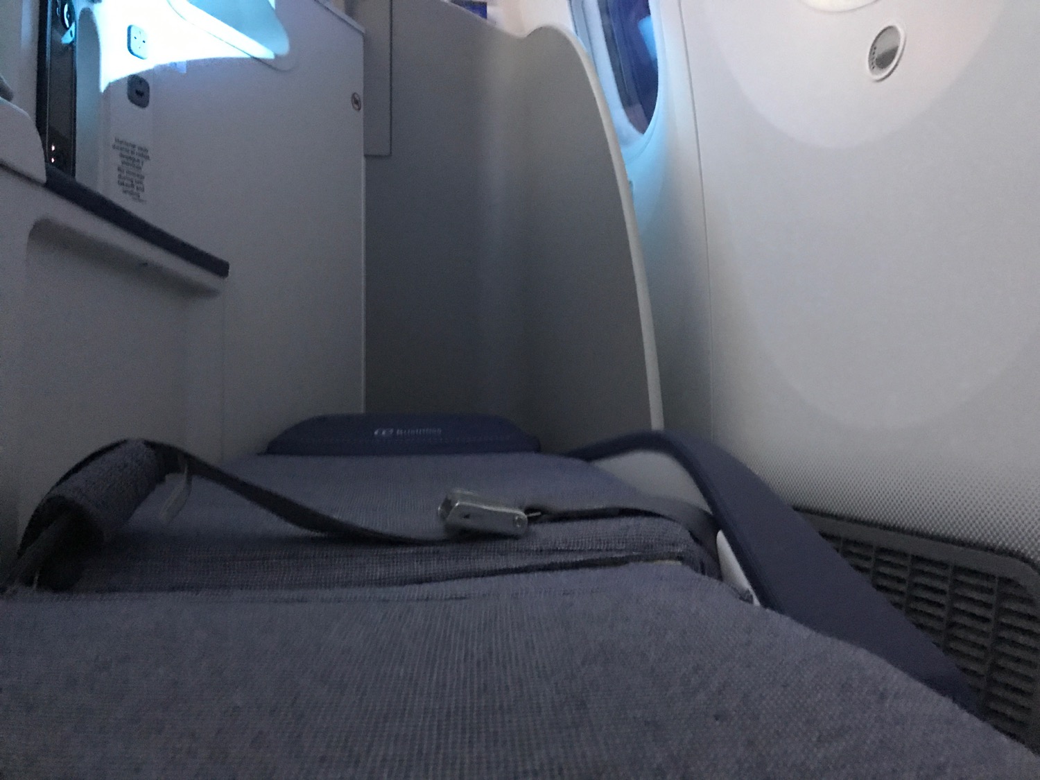 a seat belt on a seat in an airplane