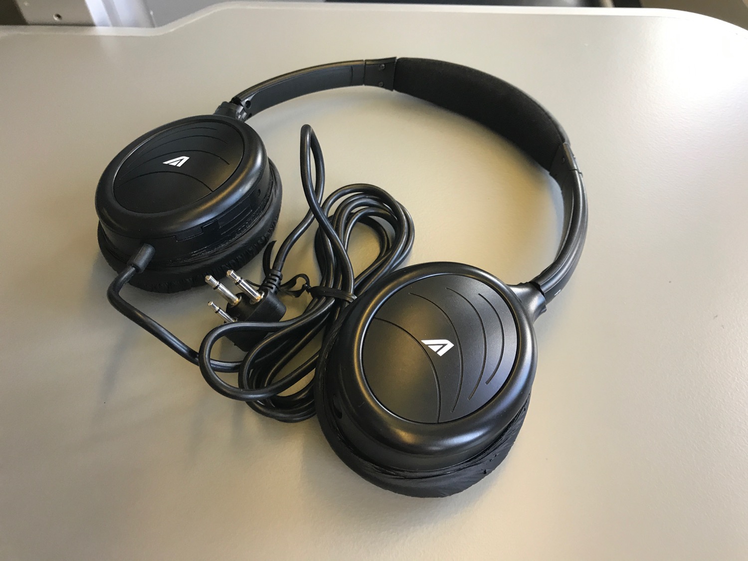 a pair of black headphones with wires