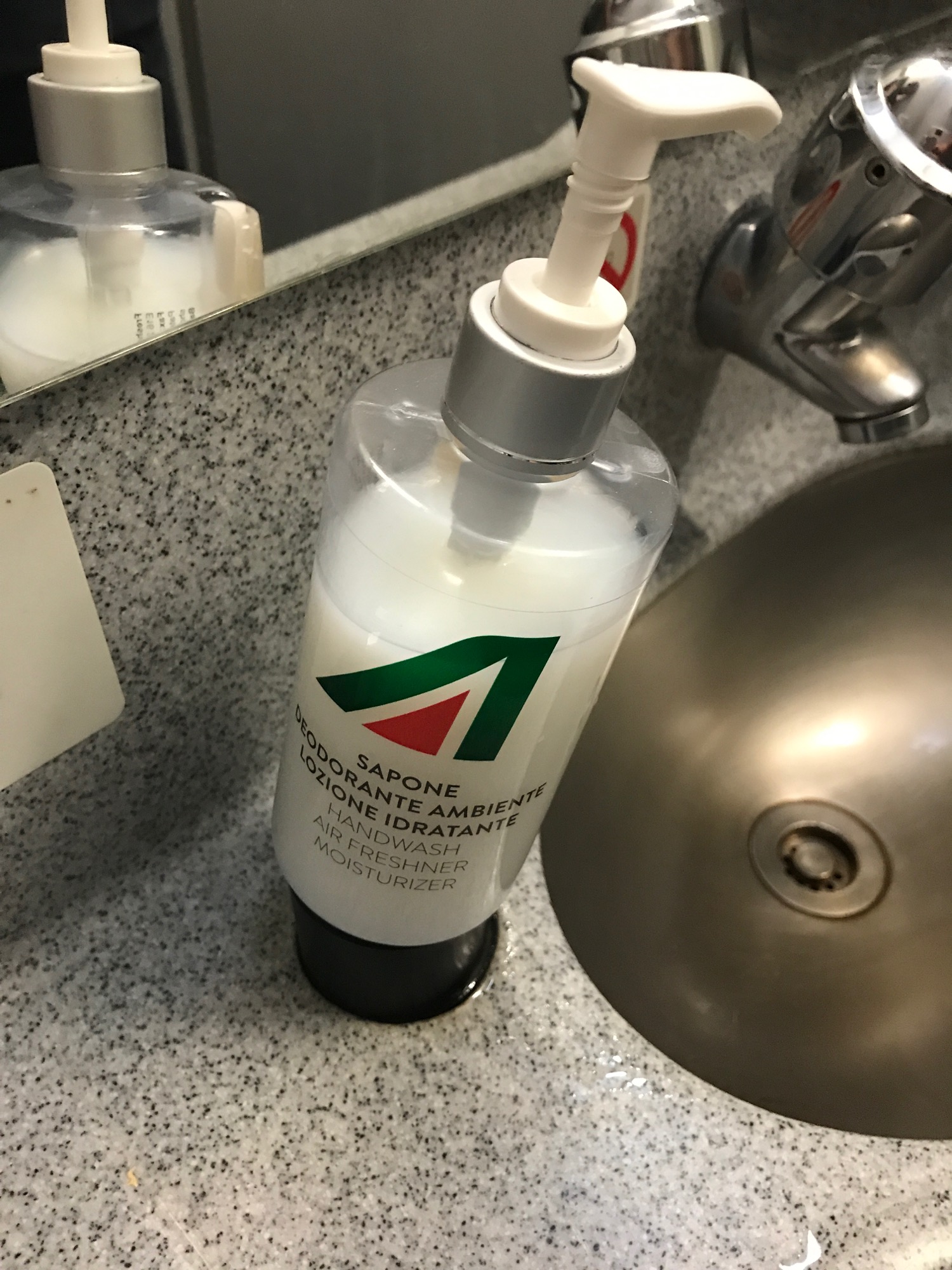 a soap dispenser on a sink