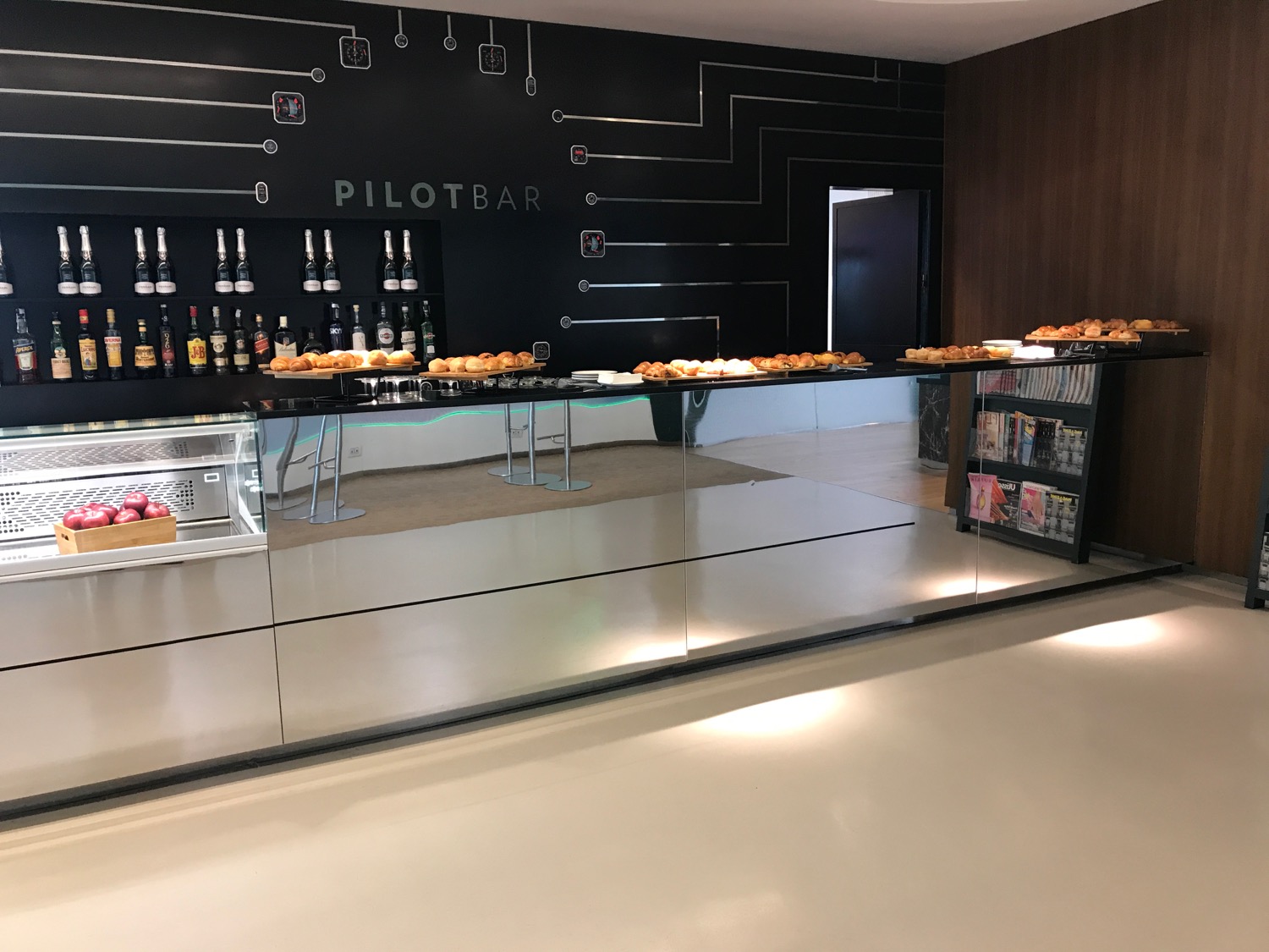 a glass counter with food on it