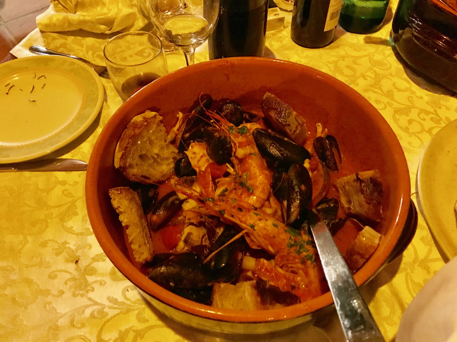 a bowl of seafood on a table