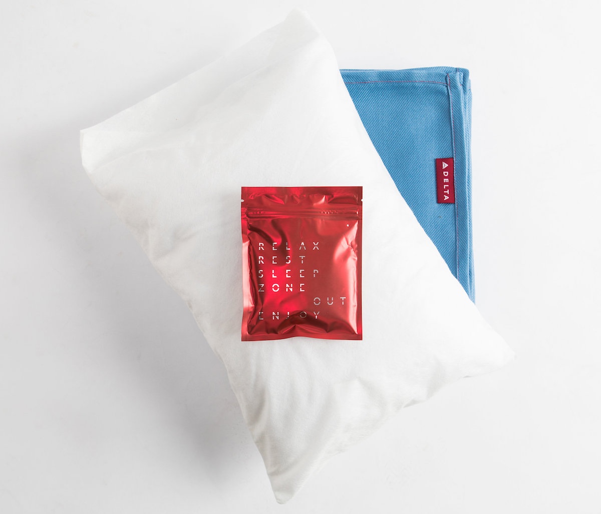 a white pillow with a red packet on it