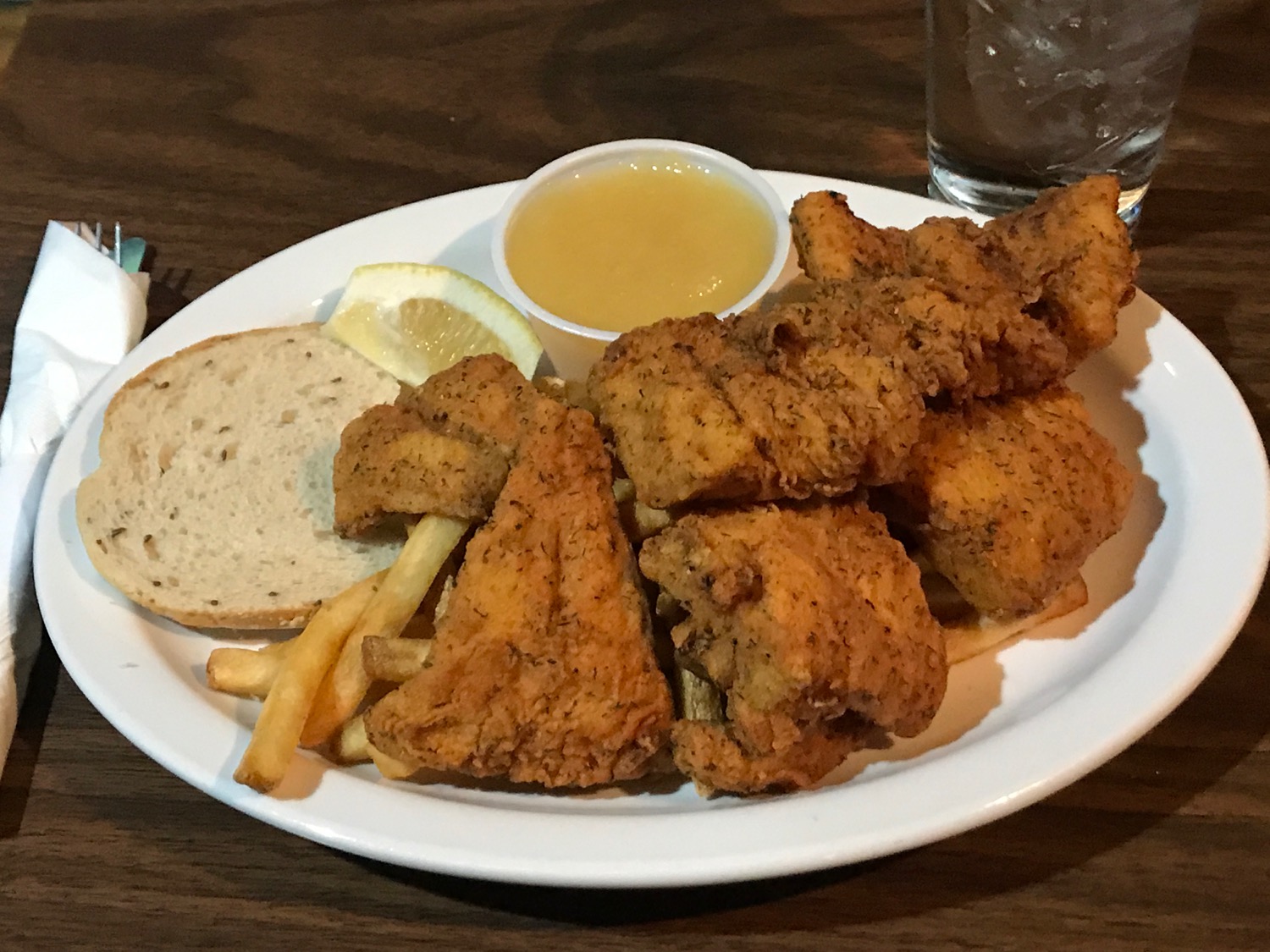 a plate of fried chicken and french fries