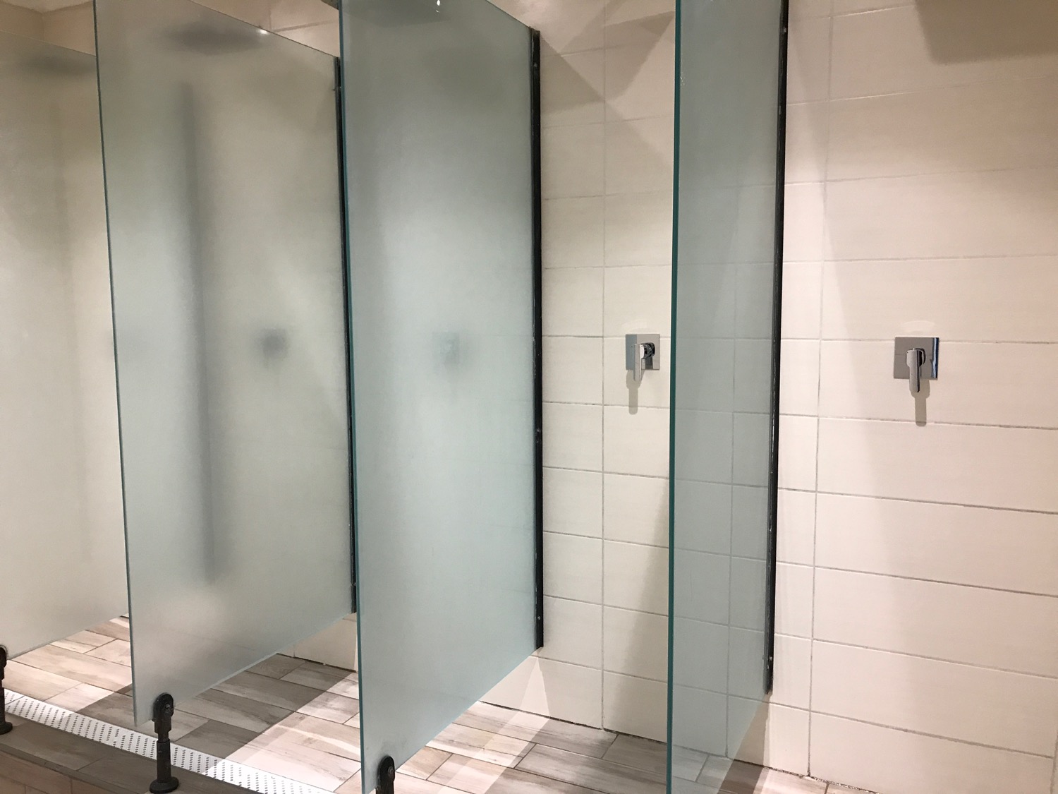 a glass shower doors in a bathroom