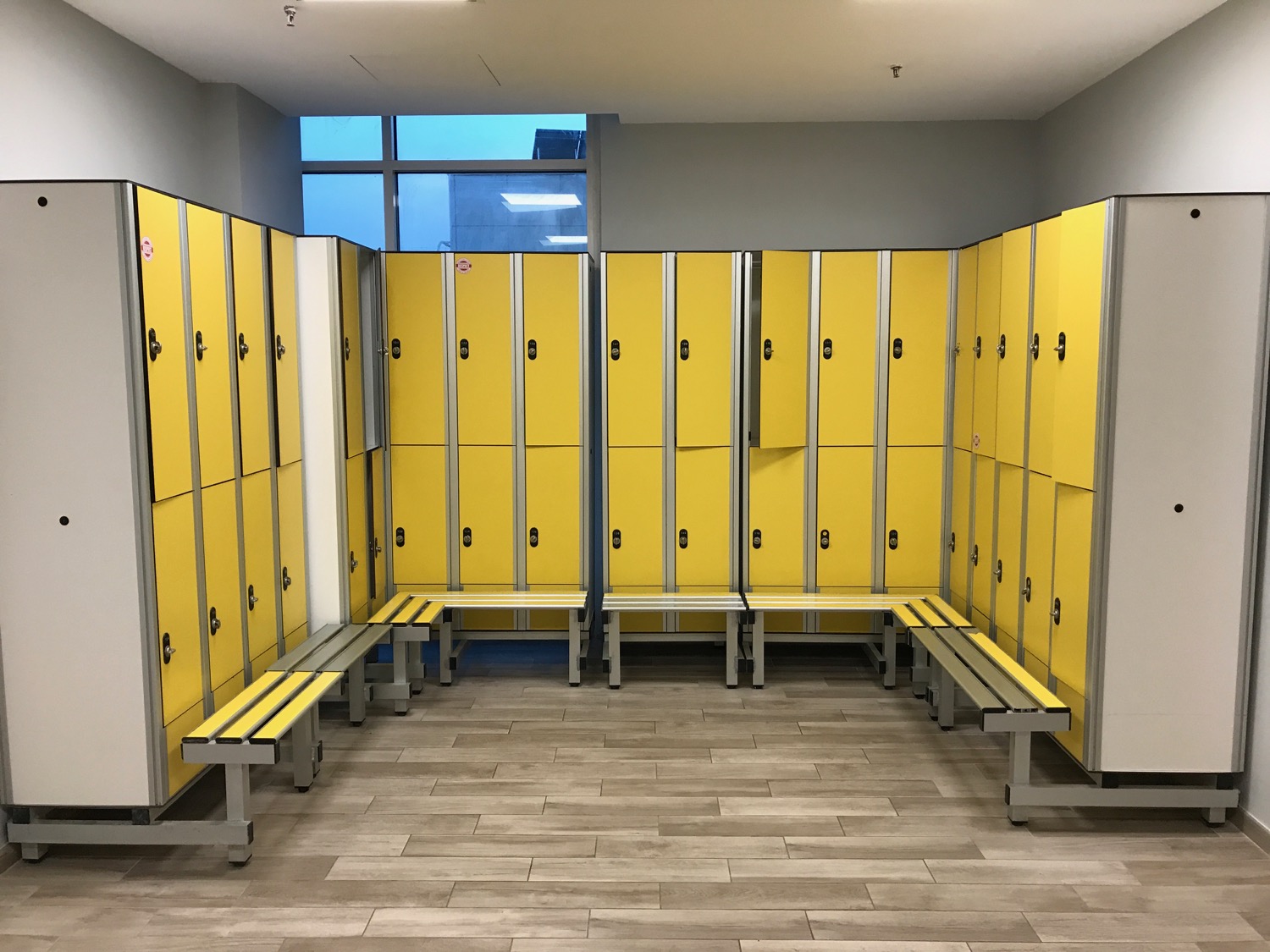 a locker room with yellow lockers