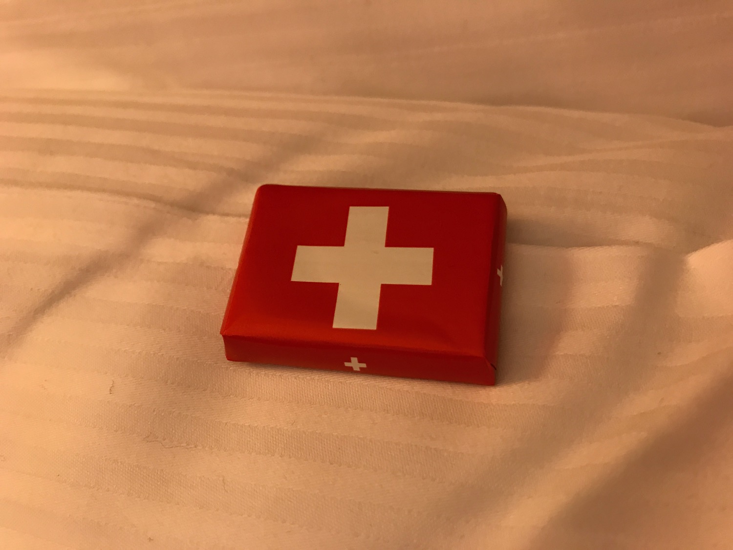 a red box with a white cross on it