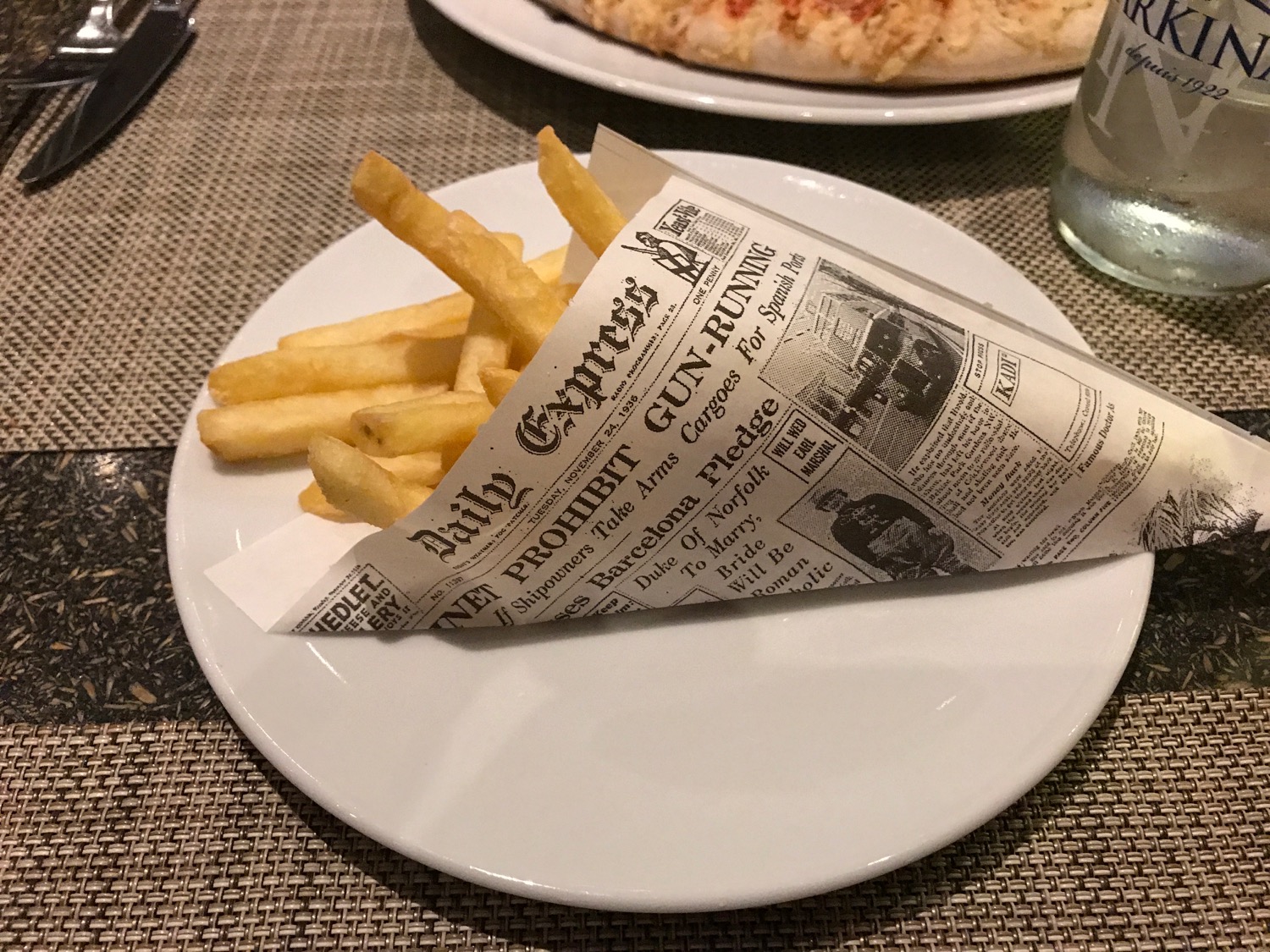 a plate of french fries on a table