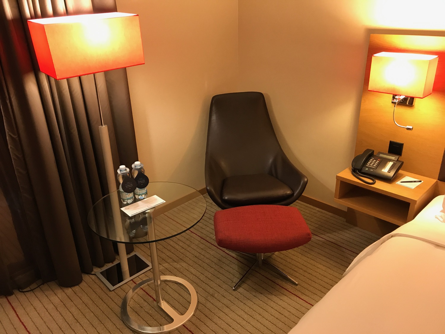 a chair and a table in a hotel room
