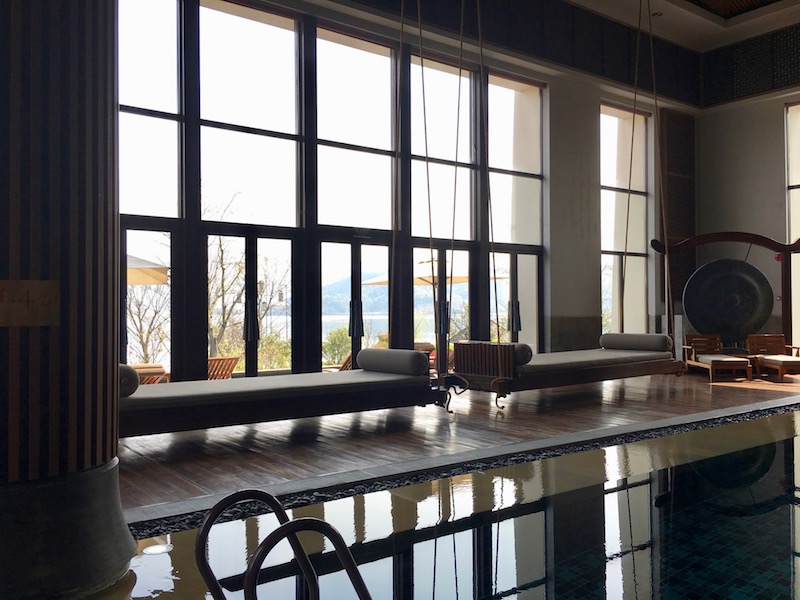 Beautiful indoor pool with a view of the lake