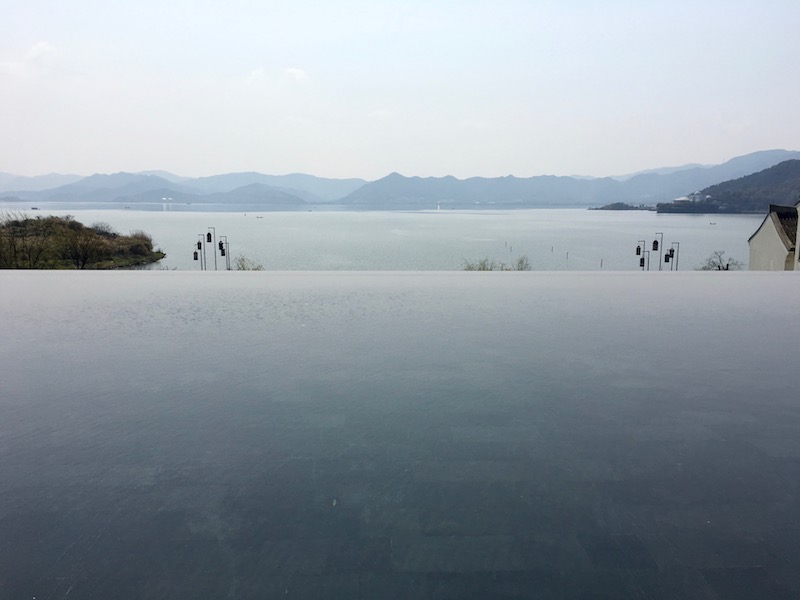 Infinity pools around the property give a sense of blending into the lake.