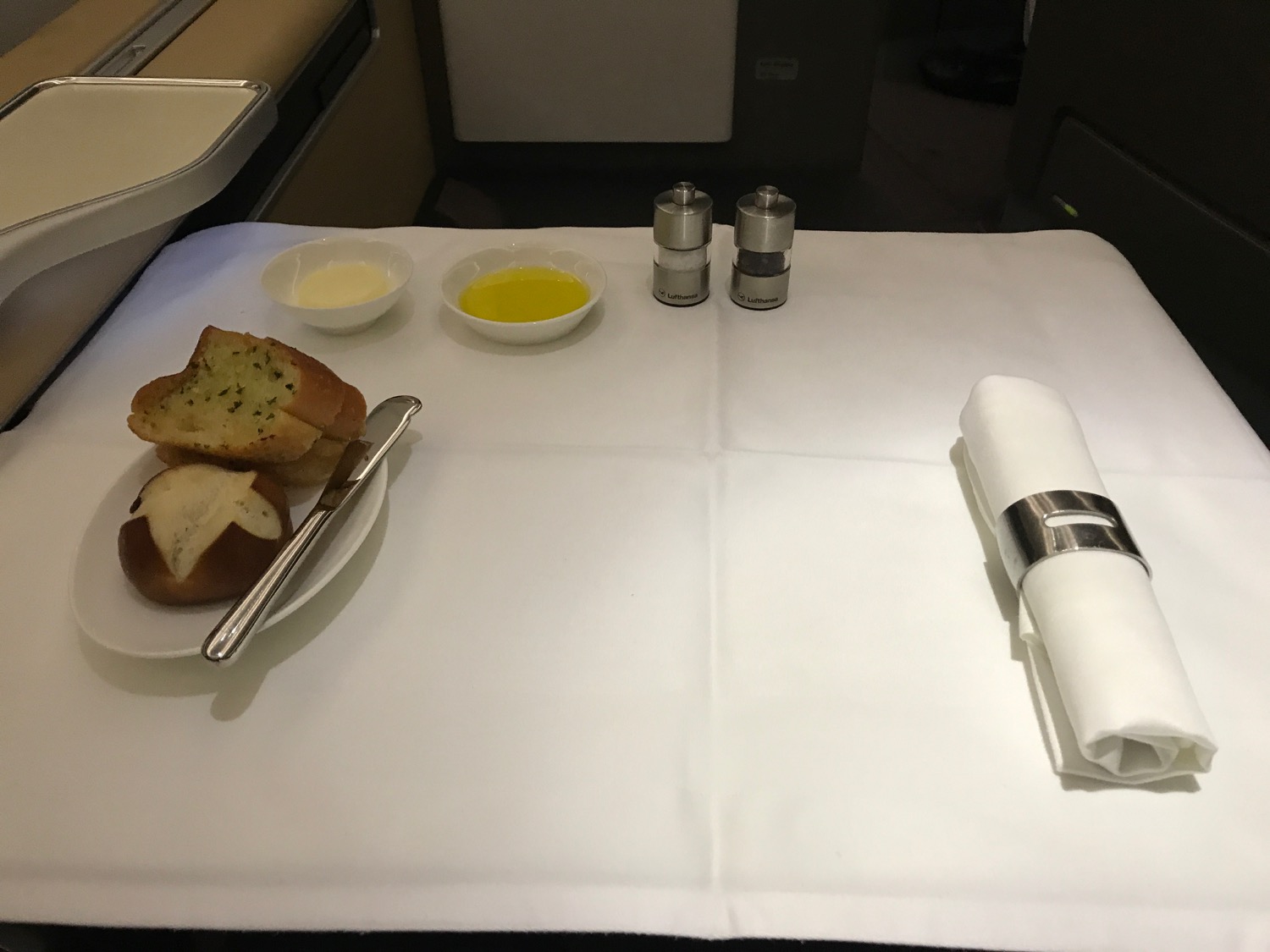 a plate of bread and butter on a table