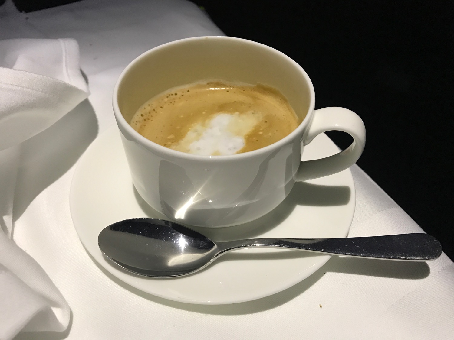 a cup of coffee with a spoon